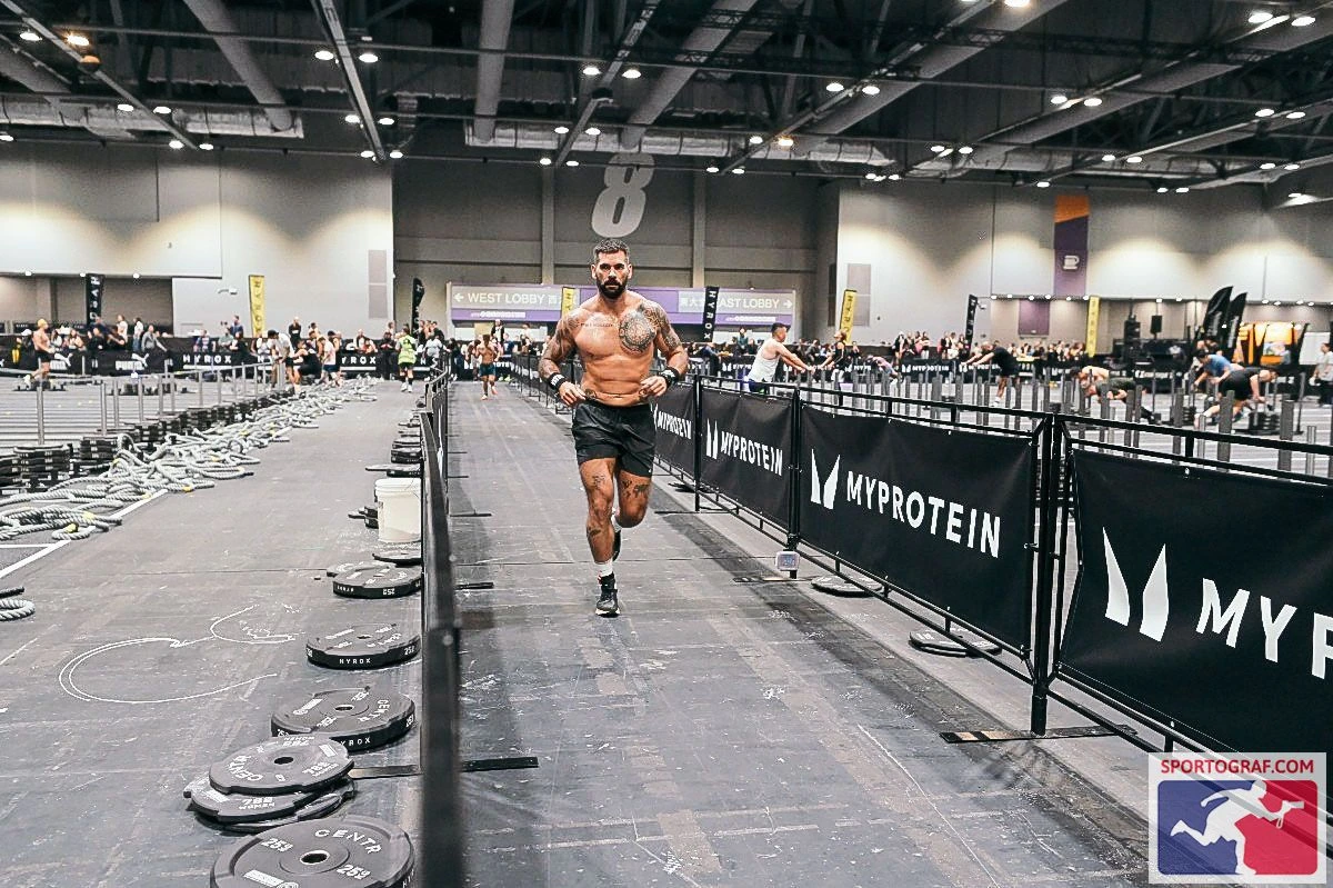 Steven running in a HYROX competition lane